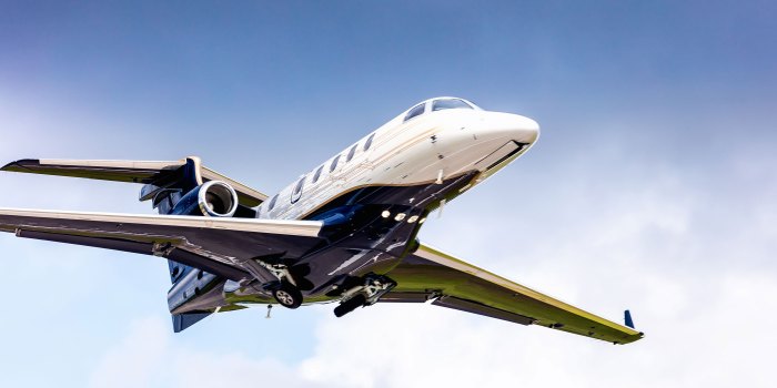 Phenom 300 jet aircraft private embraer charter jets luxury flight charters haute week pilot parked